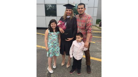 Fernandez poses with her family after graduation.