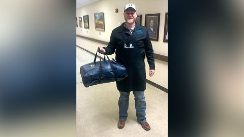 Adam Willmann, president and CEO of Goodall-Witcher Healthcare, delivers pizza to employees.