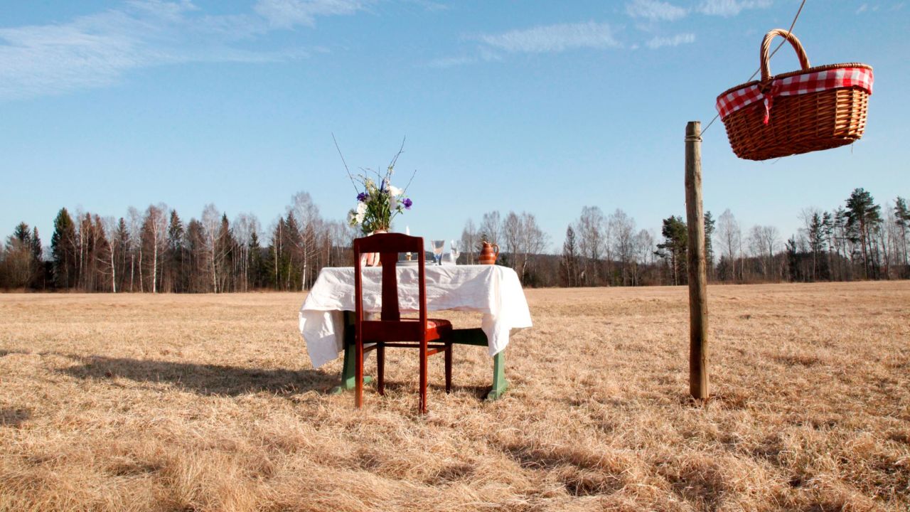 The restaurant's single table and chair is situated in a lush meadow in Värmland, Sweden.