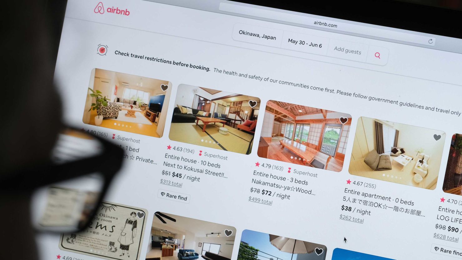 KATWIJK, NETHERLANDS - APRIL 20: In this photo illustration, a man looks at the website of Airbnb on April 20, 2020 in Katwijk, Netherlands.  (Photo by Yuriko Nakao/Getty Images)