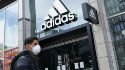 BERLIN, GERMANY - APRIL 15: A man wearing a protective face mask, who said he did not mind being photographed, walks past a temporarily closed Adidas store during the coronavirus crisis on April 15, 2020 in Berlin, Germany. As the rate of new infections nationwide continues to slow, the German government is seeking to establish and implement a roadmap for easing restrictions on public life and the burden the virus is having on the economy. So far over there are over 130,000 cases of confirmed infection of coronavirus in Germany, over 3,000 people have died and over 57,000 people have recovered. (Photo by Sean Gallup/Getty Images)