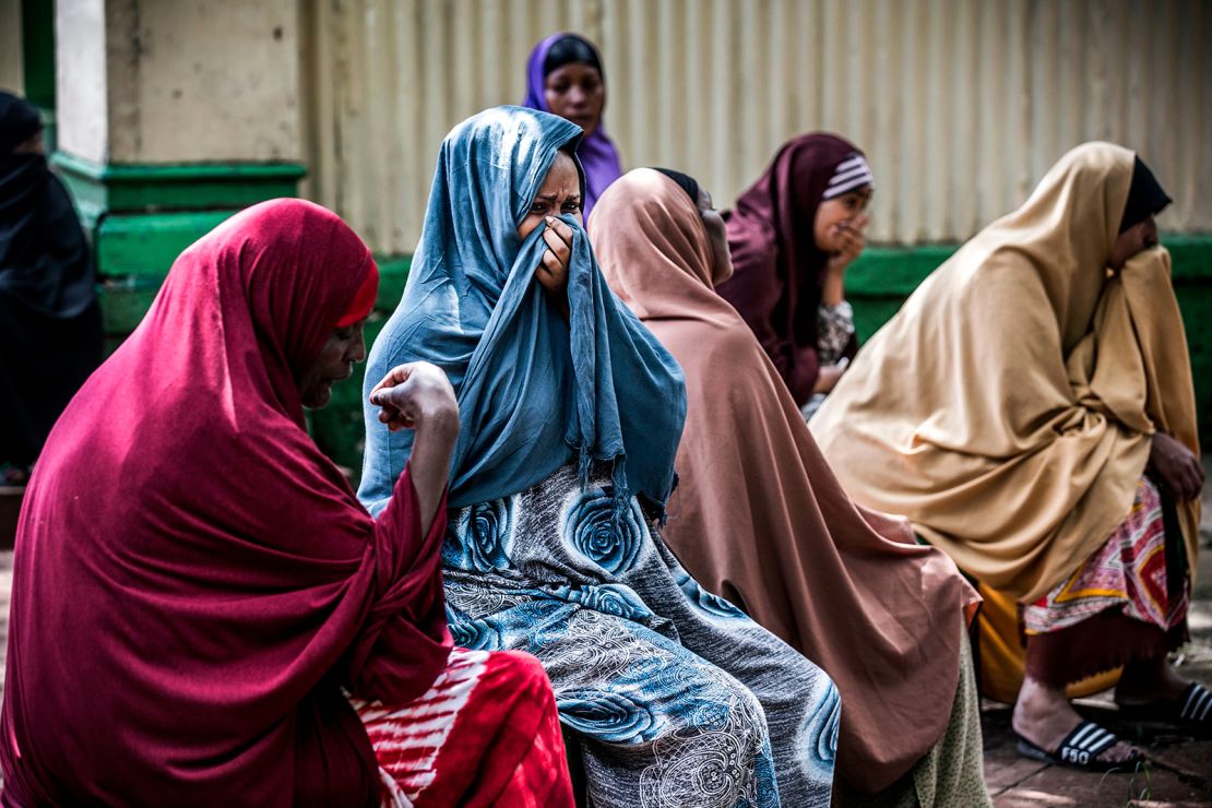 Yassin Hussein Moyo's relatives cry during his burial on March 31, 2020. 