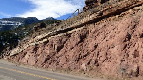 This rock exposes the Great Unconformity, where 1.1 billion-year-old Pikes Peak granite is topped with 510 million-year-old sandstone outside of Manitou Springs, Colorado.