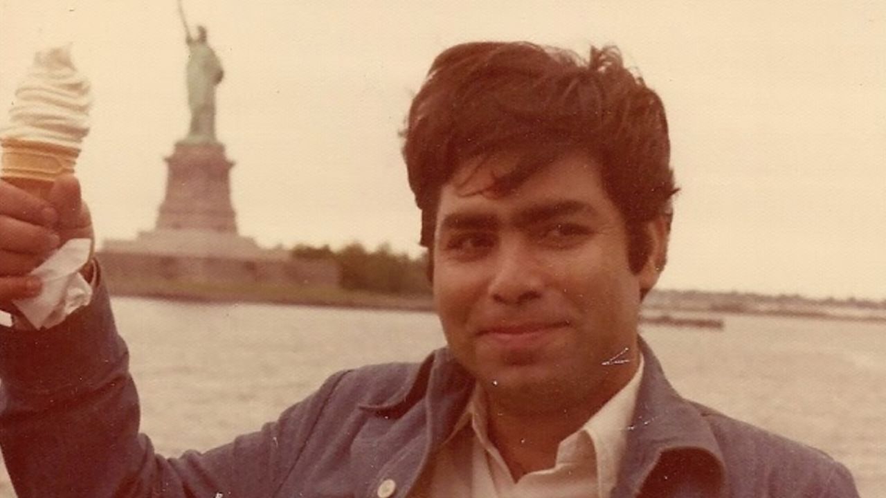 Gireesh Kumar Suri died at age 67 last week. He is pictured here with the Statue of Liberty,  not long after he arrived in America.