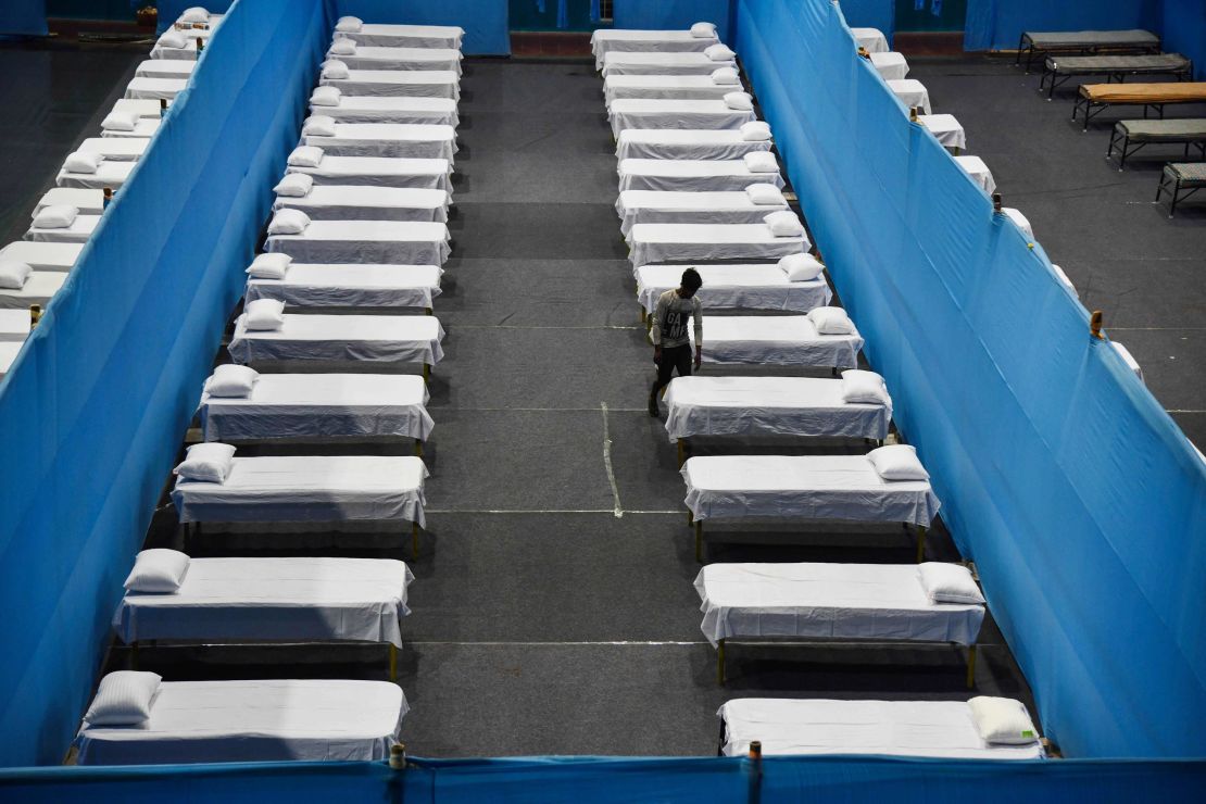 A worker arranges beds for a quarantine centre in Guwahati on March 29, 2020.
