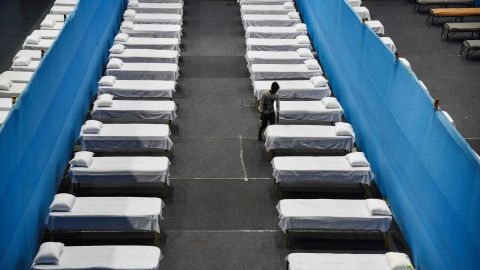 A worker arranges beds for a quarantine centre in Guwahati on March 29, 2020.