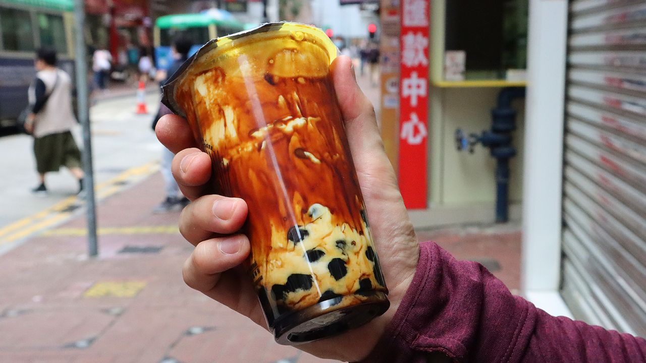In brown sugar bubble tea, fresh milk is poured into a glass layered with balls and brown sugar, creating some Instagram-worthy marbling patterns.