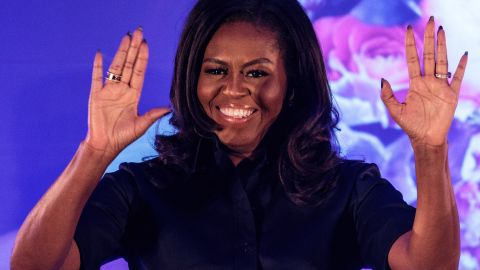 Former U.S. First Lady Michelle Obama arrives on stage at an event at the Elizabeth Garrett Anderson School on December 03, 2018 in London, England.
