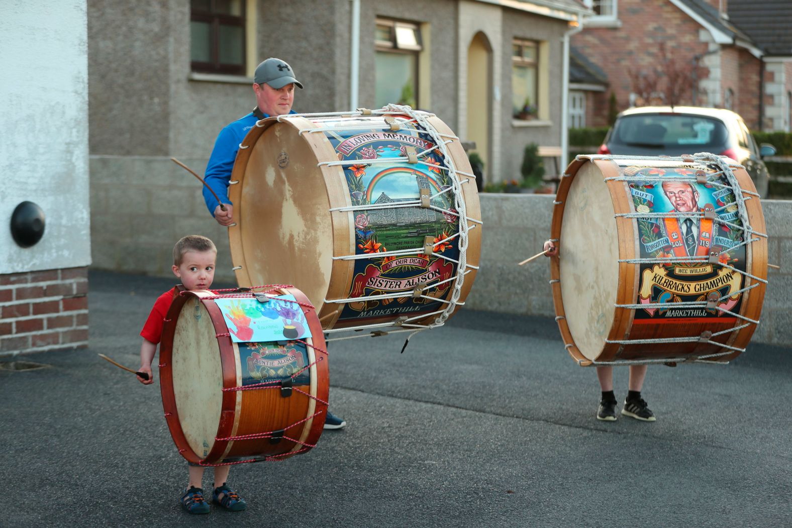 Mark Black and his sons, Thomas and Adam, play Lambeg drums outside their home in County Armagh, Northern Ireland, during the weekly "Clap for our Carers" on April 16.