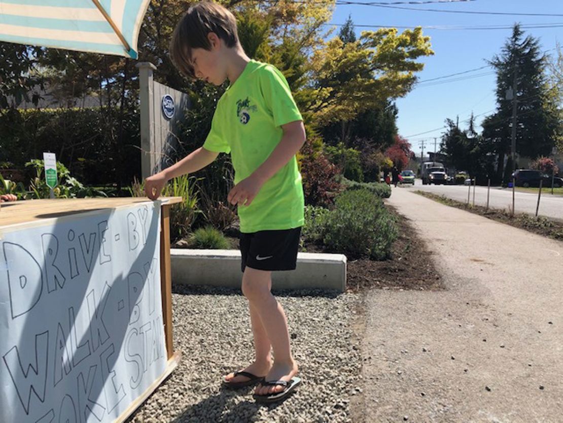 Six-year-old Callaghan McLaughlin sets up his joke stand by 9:30 a.m. each day.