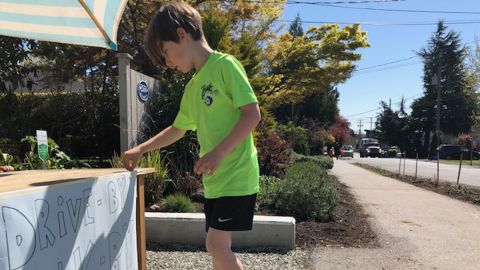 Six-year-old Callaghan McLaughlin sets up his joke stand by 9:30 a.m. each day.