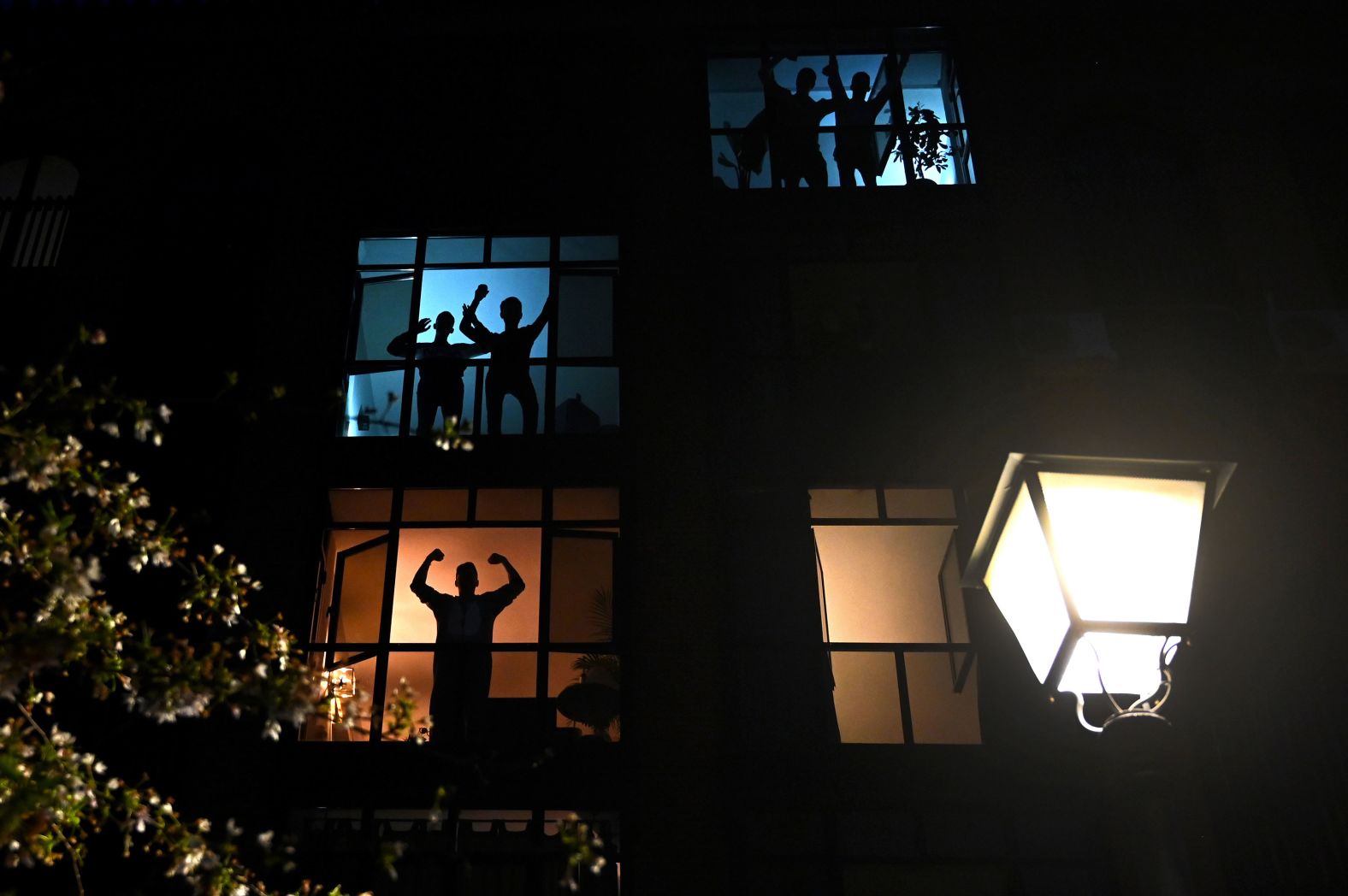 Madrid residents applaud health-care workers from their windows on March 28.