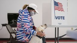SUPERIOR, WI - APRIL 7: Catherine Anderson brought her dog, Ivy, to vote in the Wisconsin Primary at the Billings Park Civic Center on Tuesday in Superior, Wisconsin. Wisconsin governor Tony Evers issued an executive order on Monday to postpone the primaries until June but the state supreme court overruled the order. (Photo by Alex Kormann/Star Tribune via Getty Images)