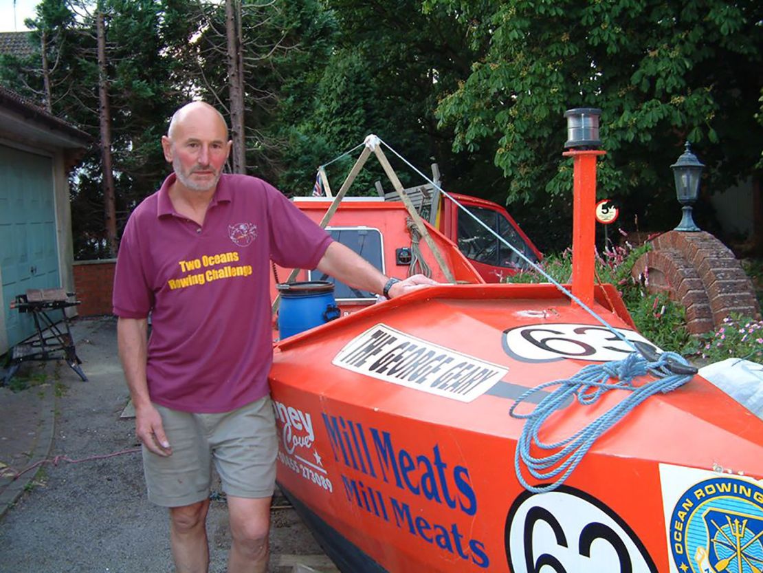 Walters poses with his boat before setting off to break the record.