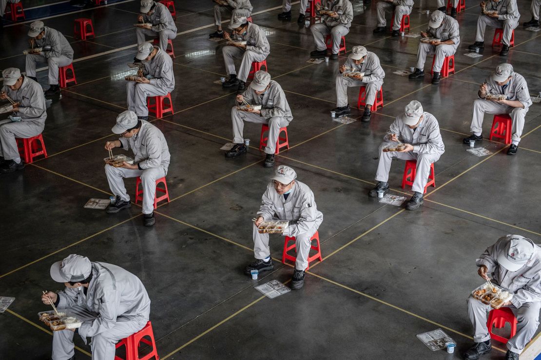 Employees on a lunch break at an auto plant of Dongfeng Honda in Wuhan, China on March 23.