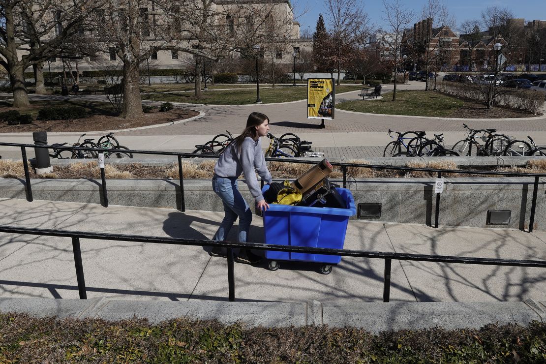 Lizzy Anderson moves out of her dorm at the University of Michigan last month. Colleges are having to refund room and board fees.