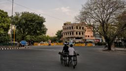 A man pushes a hand cart on a closed street during lockdown in New Delhi, India on 28 April 2020.