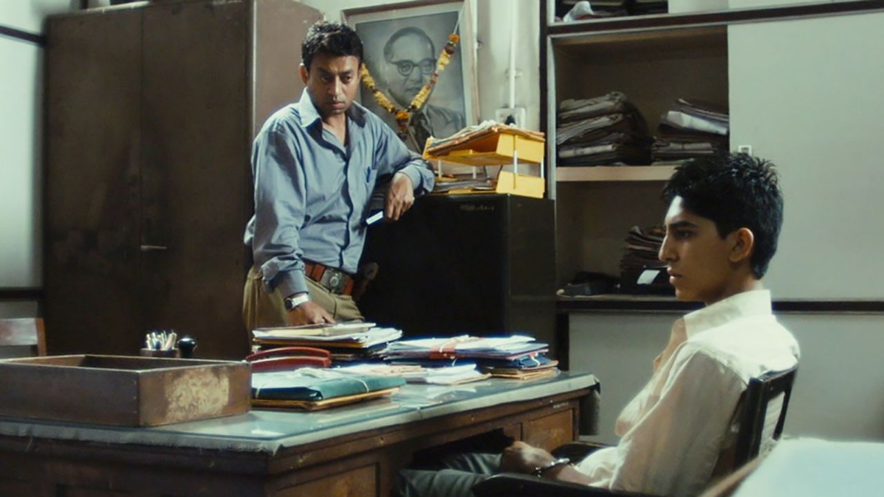 Irrfan Khan and Dev Patel in Slumdog Millionaire (2008).
