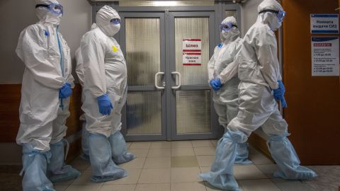Medical workers wait to enter the red zone to treat coronavirus patients at the Spasokukotsky clinical hospital in Moscow on April 22.