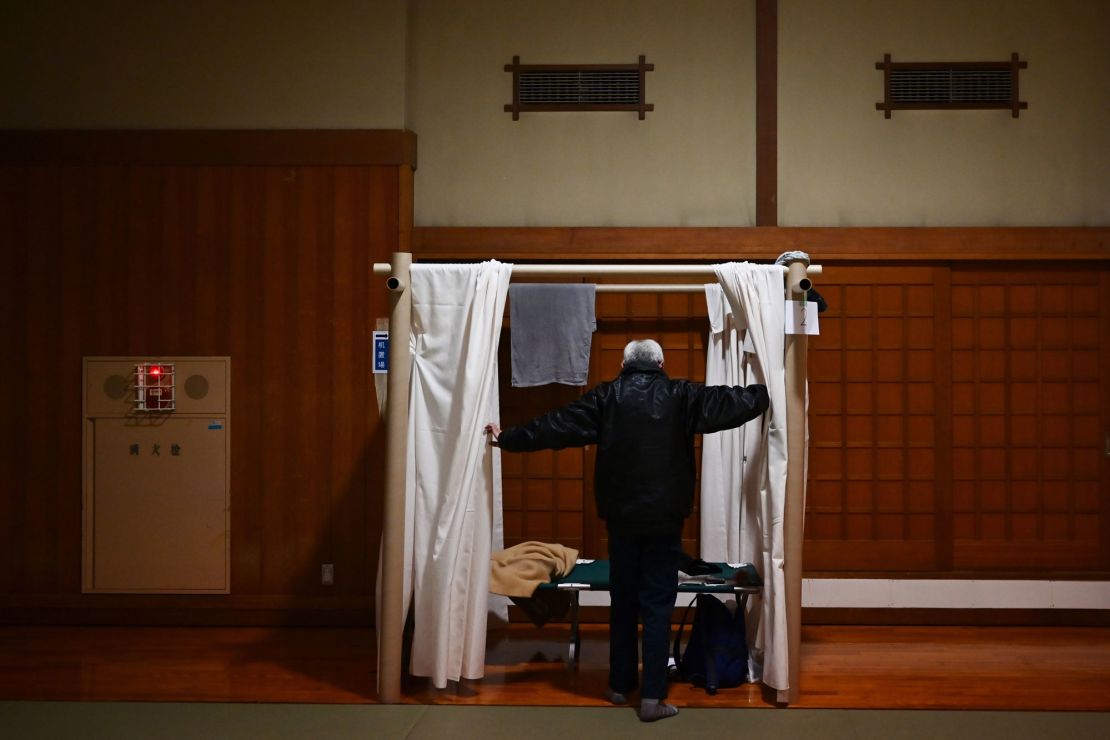 Katsuya Asao, 54, prepares to rest at a shelter provided by Kanagawa prefecture for those who used to stay at internet cafes, which  were asked to close due to the COVID-19 coronavirus outbreak state of emergency.