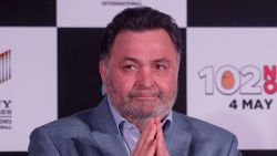 FILE- In this April 19, 2018 file photo, Bollywood actor Rishi Kapoor greets media as he arrives for the song launch of film '102 Not Out' in Mumbai, India. Rishi Kapoor, a top Indian actor and a scion of Bollywood's most famous Kapoor family, has died after a battle with cancer. He was 67.(AP Photo/Rafiq Maqbool, File)