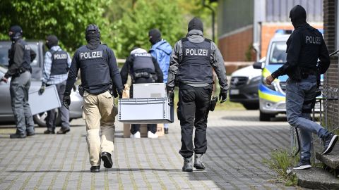 Police investigate the Hezbollah-linked Imam Mahdi center in Muenster, western Germany, on Thursday.