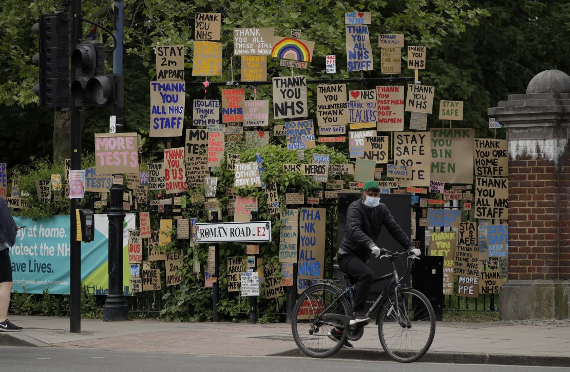 Signs supporting the National Health Service have been displayed by an artist in east London. (Matt Dunham/AP)