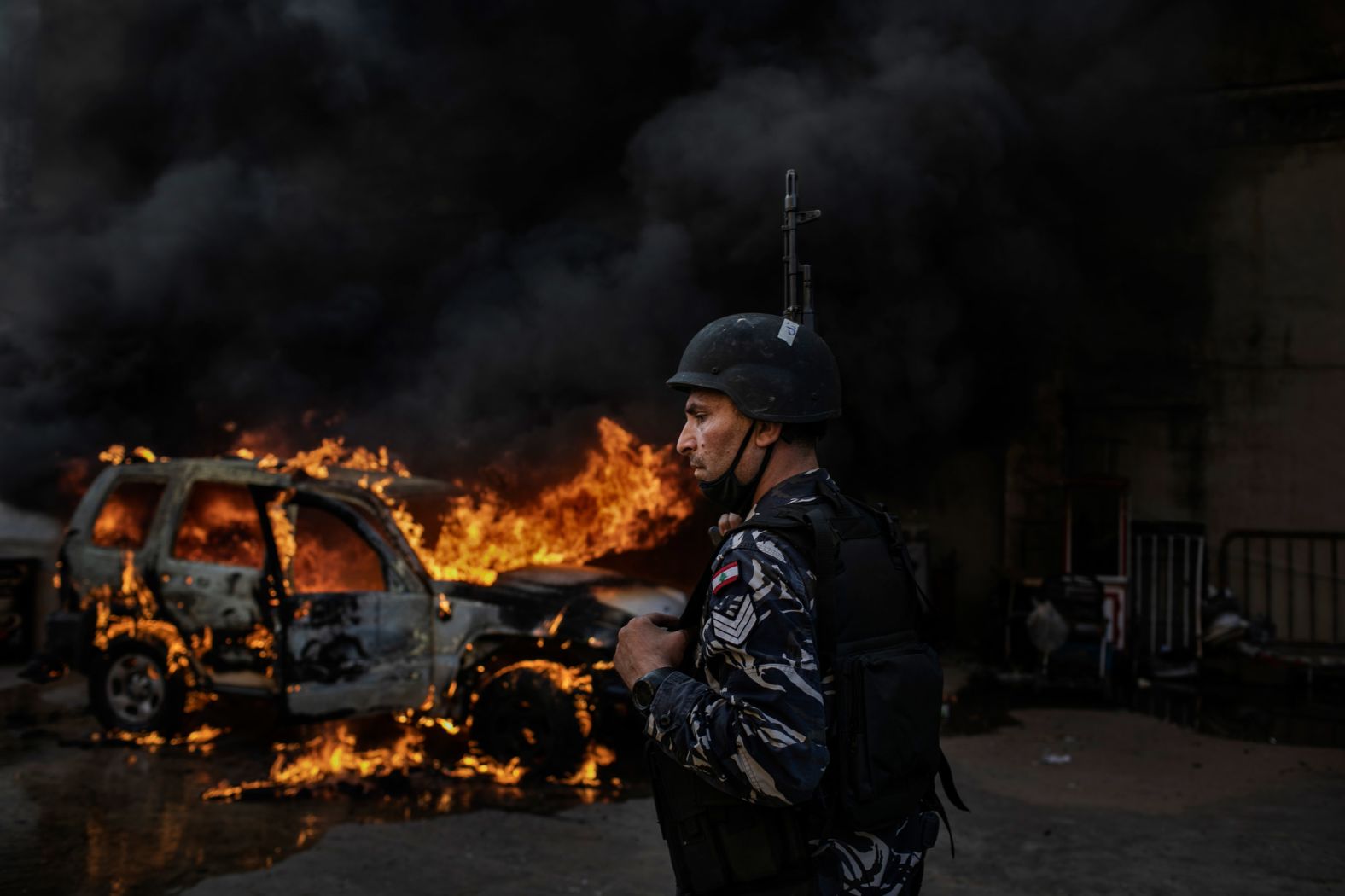 A police car burns in Tripoli on Tuesday.