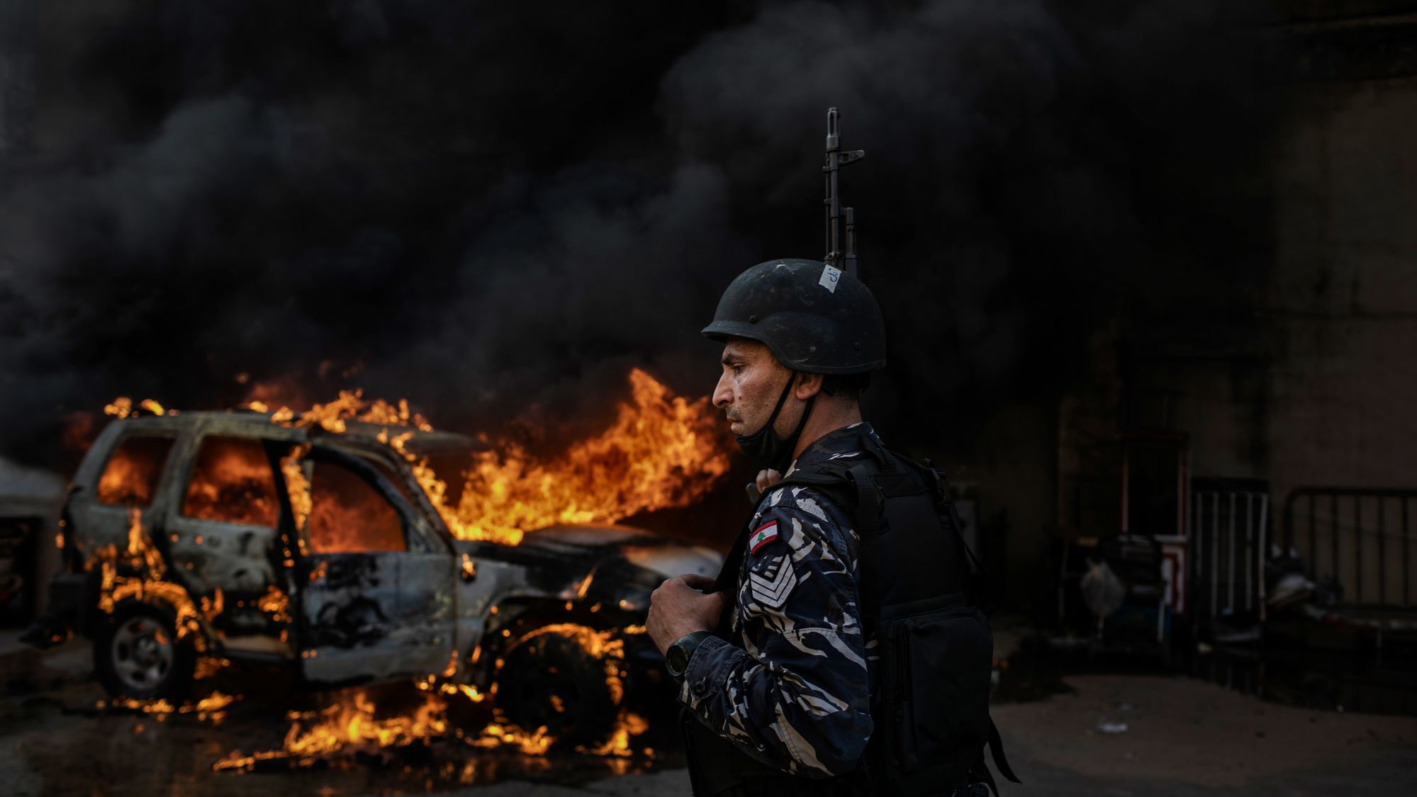 A police car burns in Tripoli on Tuesday.