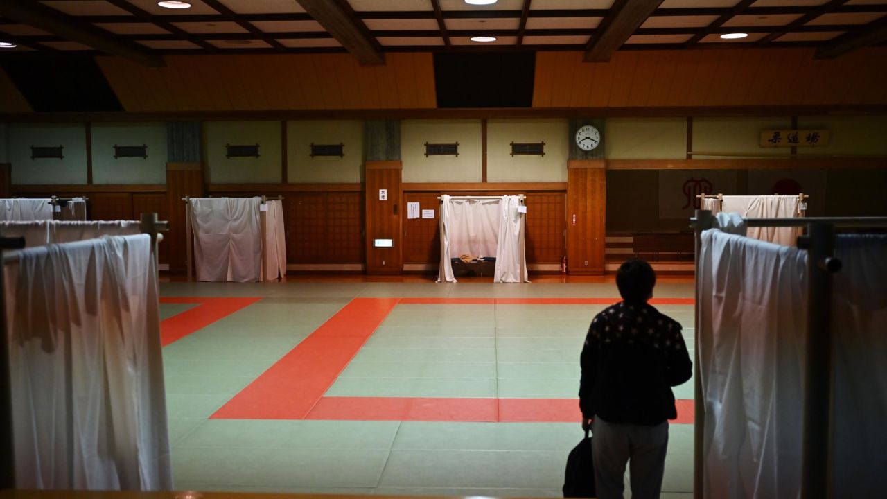A man arrives to have to sleep at a shelter provided by Kanagawa prefecture for people who used to stay in internet cafes.