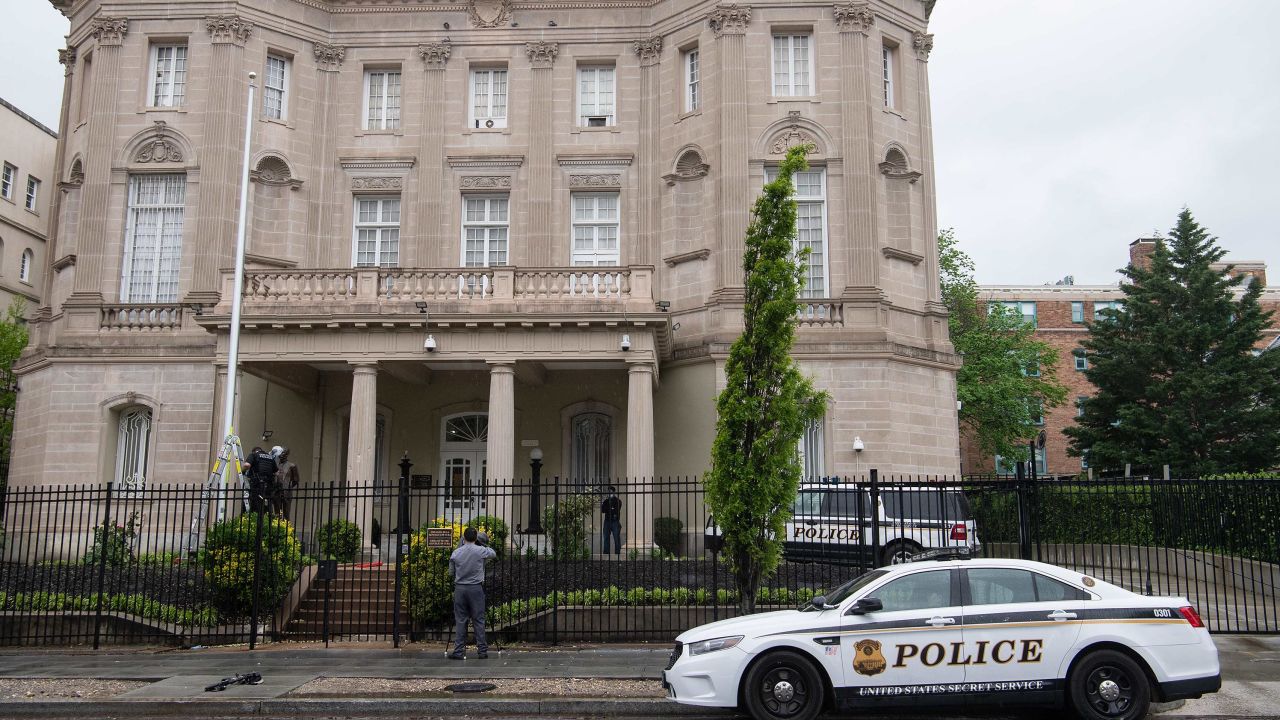Members of the US Secret Service conduct an investigation at the Cuban embassy in Washington, DC, on April 30, 2020 after a man fired at the building.
