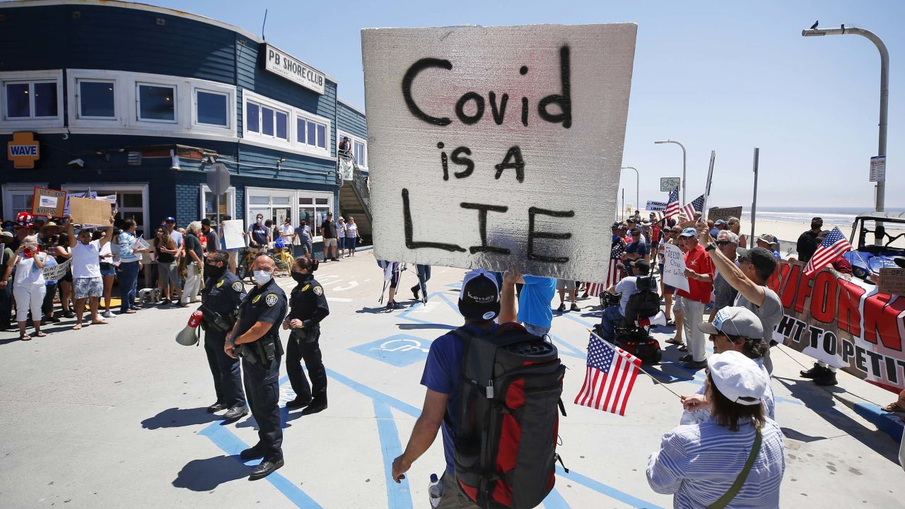 A protester claims Covid-19 is a lie. But it's killed more people than the flu this past year.