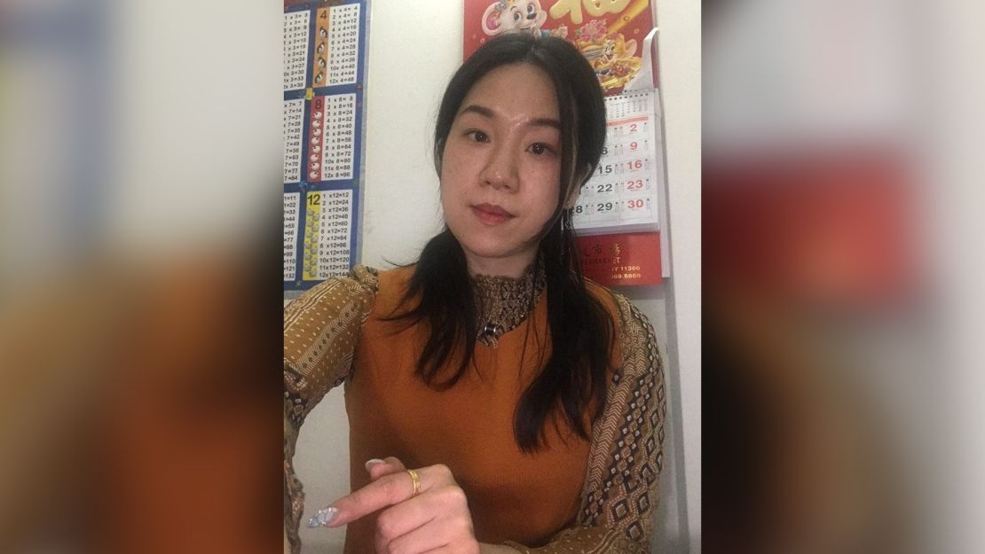 Jennifer Feng, 38, a nail technician at a mall salon in Flushing, takes a photo at home on April 30, 2020. (Jennifer Feng)