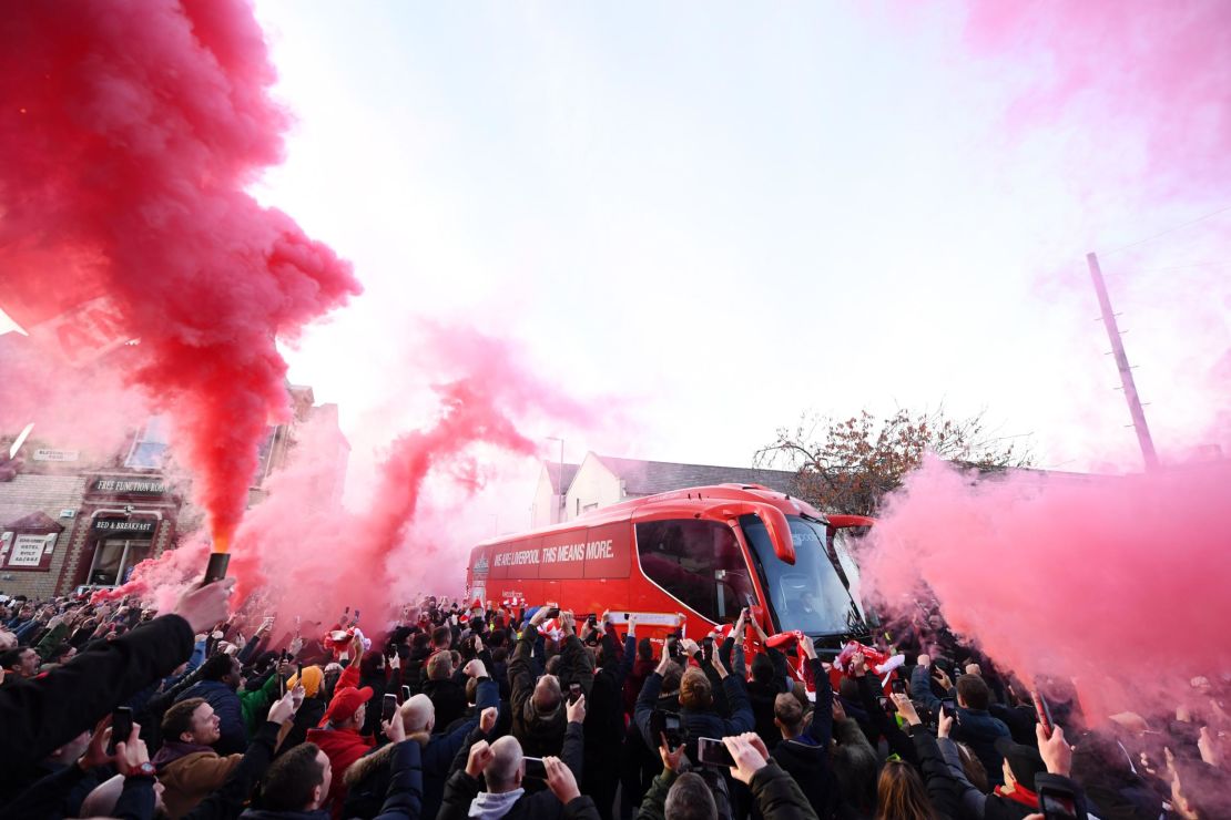 Liverpool fans let of smoke flares as their team coach arrives at the stadium prior to the Premier League match between Liverpool FC and Manchester City at Anfield on November 10, 2019.