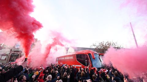 Liverpool fans let of smoke flares as their team coach arrives at the stadium prior to the Premier League match between Liverpool FC and Manchester City at Anfield on November 10, 2019.