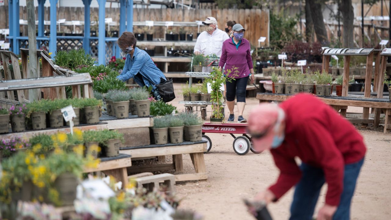 Customers shop at Fort Collins Nursery in Fort Collins, Colo., on April 30, 2020. Local garden centers and Colorado master gardeners say they've seen a huge surge of interest in growing food crops in home gardens since the coronavirus pandemic upended daily life almost two months ago, leaving nearly 300,000 Coloradans unemployed and most of its residents at home under strict social distancing guidelines.