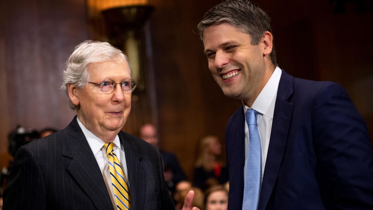 Senate Majority Leader Mitch McConnell talks with Justin Reed Walker before a Senate Judiciary Committee in July 2019. 