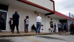 FILE PHOTO: People who lost their jobs wait in line to file for unemployment following an outbreak of the coronavirus disease (COVID-19), at an Arkansas Workforce Center in Fayetteville, Arkansas, U.S. April 6, 2020. REUTERS/Nick Oxford/File Photo