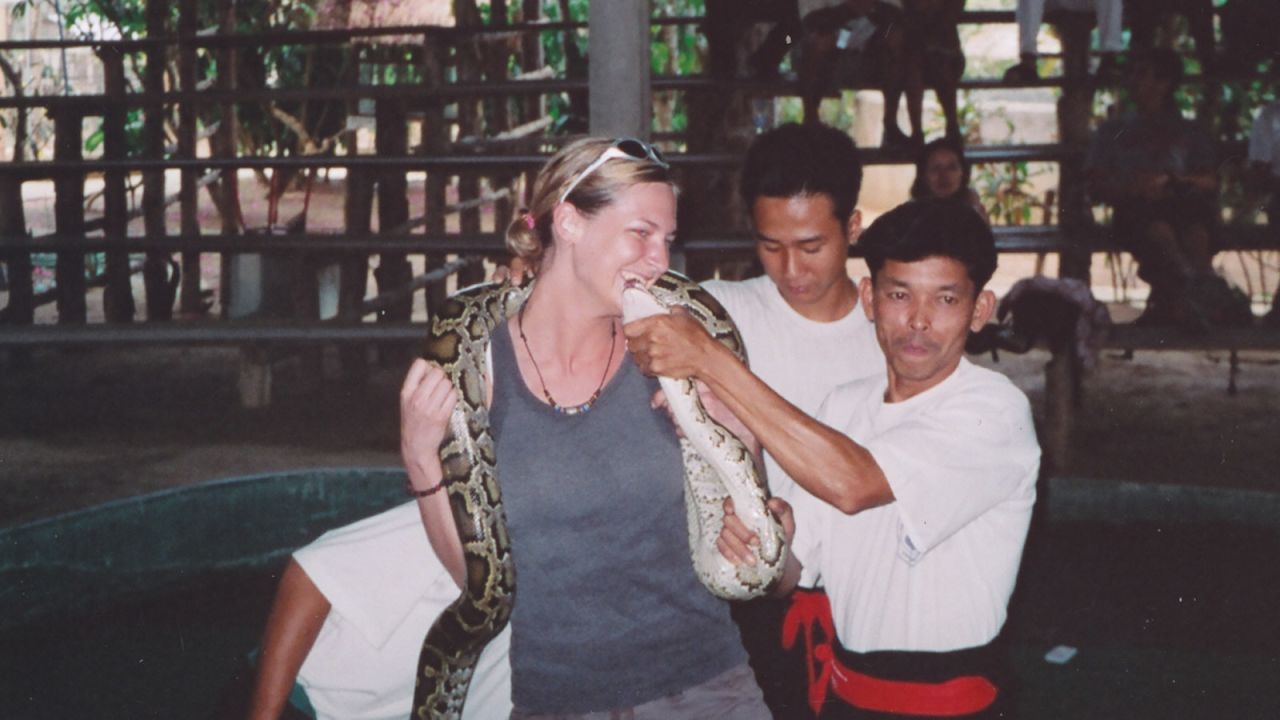 <strong>Cuddling the local critters:</strong> After the trek, we hit up one of  Chiang Mai's snake-based attractions. I still remember the announcer's booming, heavily accented voice, commanding me to "Kisssss the snake. Kissss it."  (Admittedly, we were ignorant tourists. Nowadays, I avoid such attractions.) 
