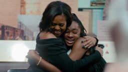 Michelle Obama shares a hug with a fan in 'Becoming.'