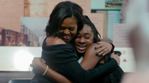 Michelle Obama shares a hug with a fan in "Becoming."