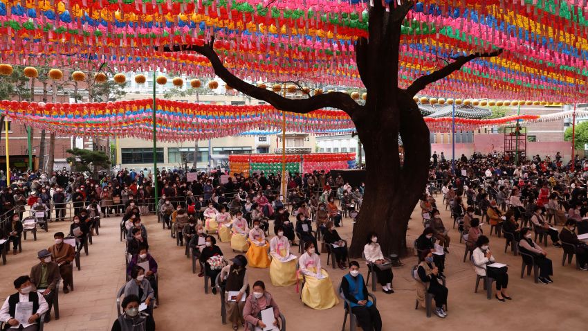 SEOUL, SOUTH KOREA - APRIL 30: Buddhist believers wear masks as a preventive measure against the coronavirus (COVID-19), as they gather during a birthday of Buddha and service to pray for overcoming the coronavirus (COVID-19) pandemic at Jogyesa Temple on April 30, 2020 in Seoul, South Korea. Buddha was born approximately 2,564 years ago, and although the exact date is unknown. South Korea reported yet another single-digit increase in the number of coronavirus infections, but the country is keeping a watchful eye on this week's holidays, which could lead to more cases. According to the Korea Center for Disease Control and Prevention, 4 new cases were reported. The total number of infections in the nation tallies at 10,765. (Photo by Chung Sung-Jun/Getty Images)