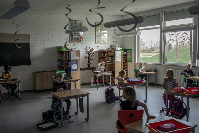 Elementary school children sit at desks spaced apart in L?gumkloster, Denmark, on April 16.