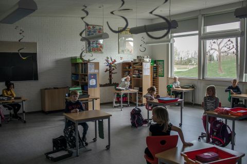 Elementary school children sit at desks spaced apart in Løgumkloster, Denmark, on April 16.