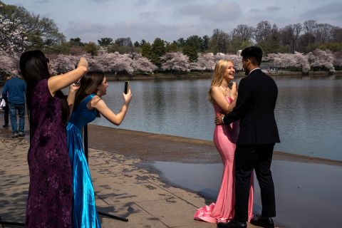 Hailey Hill and her boyfriend, Tony Cho, take pictures in Washington on March 19 after their high-school prom was canceled.