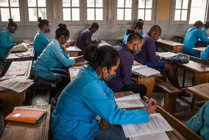 Students wear protective face masks on April 22 as they study at J.J. Rabearivelo High School in Antananarivo, Madagascar.