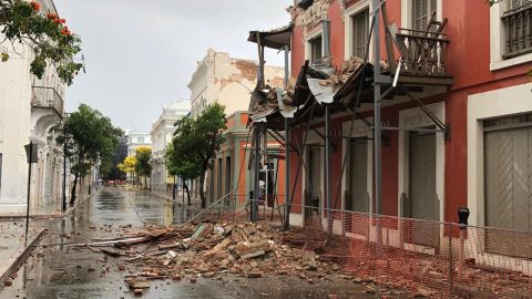 Rubble litters a street in Puerto Rico after Saturday's temblor.