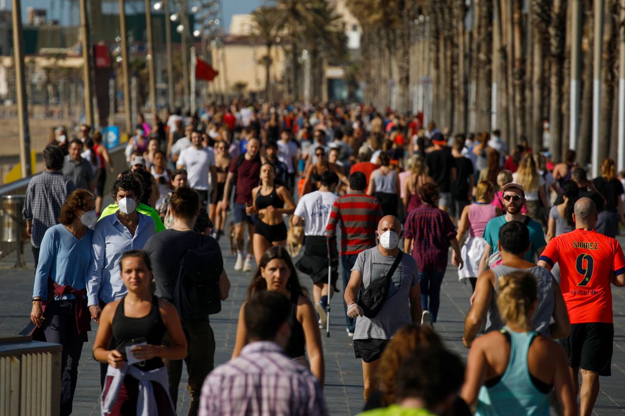 People exercise on a seafront promenade in Barcelona, Spain, on May 2, 2020. Spaniards filled the country's streets to <a href="https://www.cnn.com/2020/05/02/europe/spain-lockdown-coronavirus-exerc