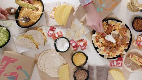 Taco Bell's At Home Taco Bar can feed six people for $25 and is available by delivery or drive-thru. 