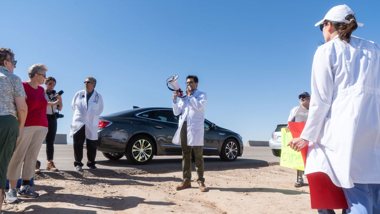 Dr. Pritesh Gandhi addresses doctors, nurses and medical students gathered at the Tornillo Port of Entry on in June 2018 in Tornillo, Texas, to demand an end to separation of immigrant children from their parents. He's one of many medical professionals running for elected office this cycle on a platform of in part defending science. 